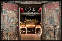 Painted doors, looking towards gate at night, Tienhou Temple. Lukang, Taiwan (color)