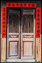 Wooden door with chinese script on red paper. Lukang, Taiwan (color)