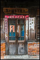 Door with weathered wood and inscriptions. Lukang, Taiwan (color)