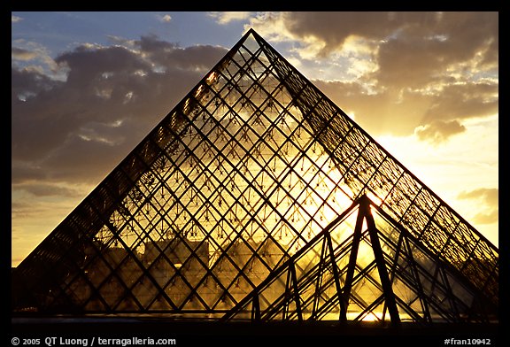Sunset and clouds seen through Pyramid, the Louvre. Paris, France (color)