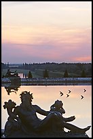 Sculptures, basin, and gardens at dusk, Versailles Palace. France (color)