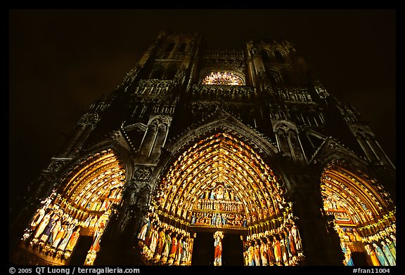 Looking up cathedral with doors laser-illuminated to recreate original colors, Amiens. France (color)