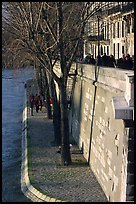 Walking on the banks of the Seine on the Saint-Louis island. Paris, France ( color)