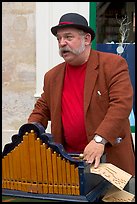 Street musician with Barrel organ. Quartier Latin, Paris, France (color)