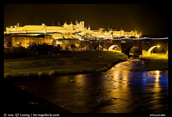 Fortified city and Pont Vieux crossing the Aude River by night. Carcassonne, France (color)