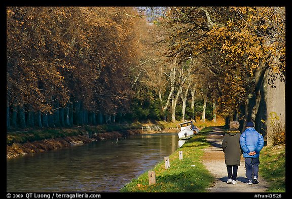 Couple walking along Canal du Midi. Carcassonne, France (color)