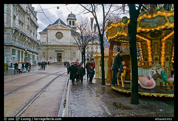 Street carousel and church. Grenoble, France