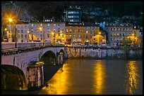 Isere River, Citadelle stone bridge and old houses at dusk. Grenoble, France ( color)