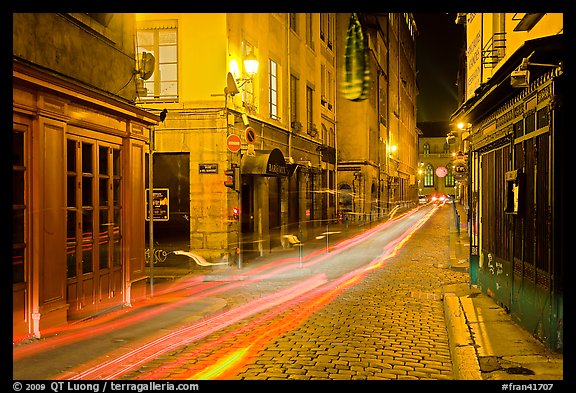 Street with light trails left by cars. Lyon, France (color)
