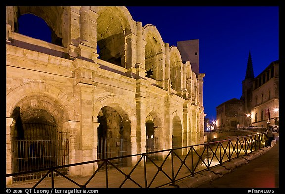 Arenes and church at night. Arles, Provence, France