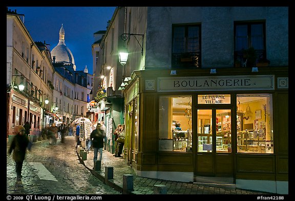 Bakery, street and dome of Sacre-Coeur at twilight, Montmartre. Paris, France (color)