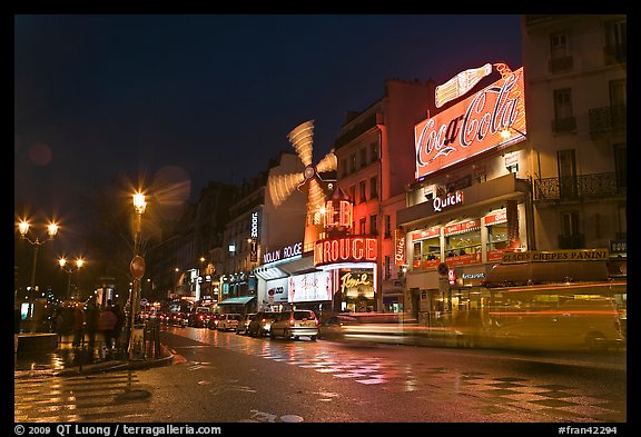 Boulevard by night with Moulin Rouge. Paris, France (color)