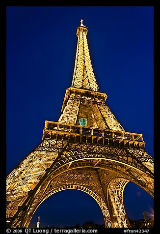 Illuminated  Eiffel Tower seen from close. Paris, France