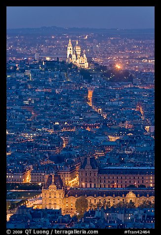 Aerial view with Louvre and Montmartre at night, Montmartre. Paris, France