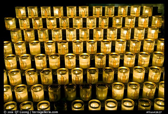 Array of candles, Notre-Dame cathedral. Paris, France (color)