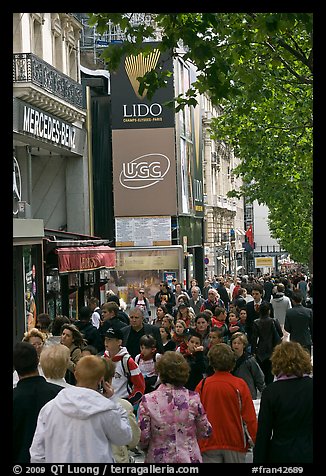 Pedestrians on a Champs-Elysees sidewalk. Paris, France