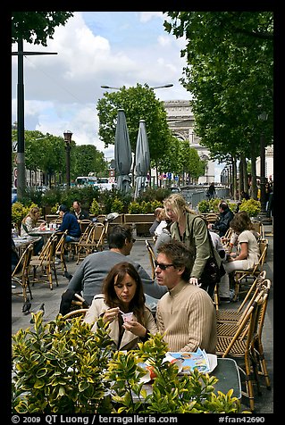 Couple at outdoor cafe on the Champs-Elysees. Paris, France
