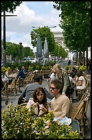 Couple at outdoor cafe on the Champs-Elysees. Paris, France (color)