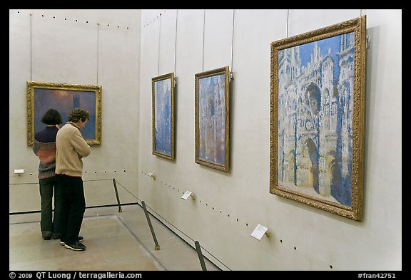 Tourists looking at Monet's Rouen Cathedral, Orsay Museum. Paris, France (color)