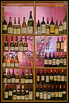 Wine bottles in storefront, passage Vivienne. Paris, France (color)