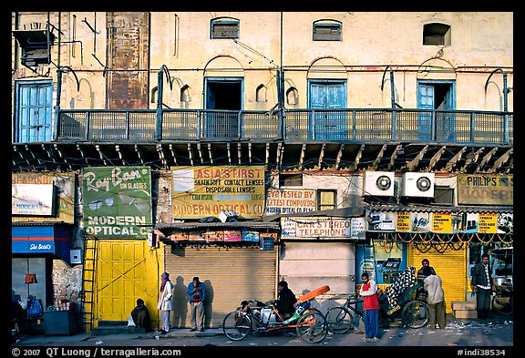 Street with old buildings and storefronts closed, Old Delhi. New Delhi, India