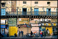Street with old buildings and storefronts closed, Old Delhi. New Delhi, India (color)