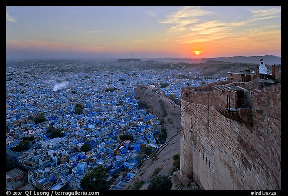 Mehrangarh Fort walls, blue houses, and setting sun. Jodhpur, Rajasthan, India