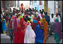 Women in colorful sari in a narrow street during wedding. Jodhpur, Rajasthan, India