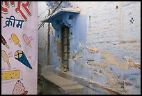 Whitewashed walls with indigo tint and ice-cream depictions. Jodhpur, Rajasthan, India