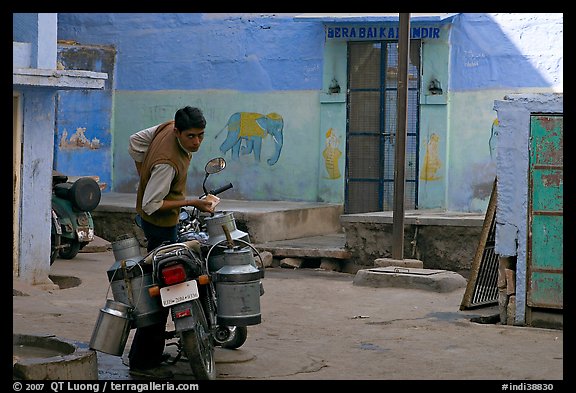 Man with milk delivery motorbike. Jodhpur, Rajasthan, India
