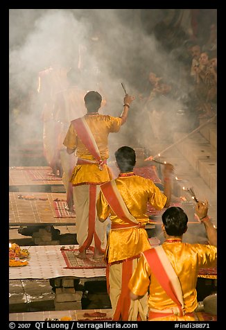 Brahmans standing amongst clouds of incense during puja. Varanasi, Uttar Pradesh, India (color)
