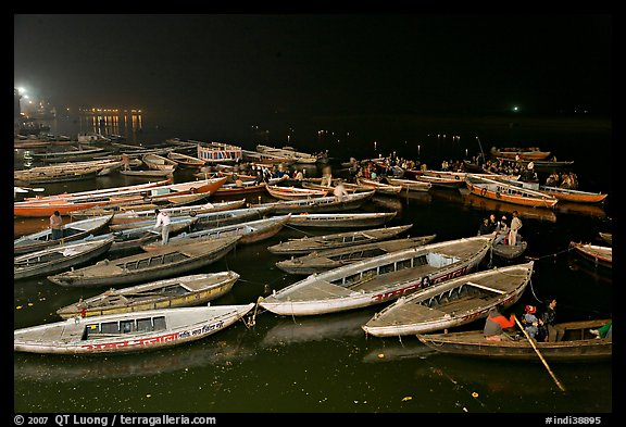 Boats on the Ganges River at night during arti ceremony. Varanasi, Uttar Pradesh, India
