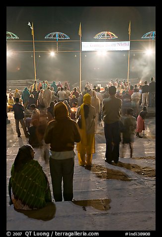 Worshipers during evening arti ceremony at Ganga Seva Nidhi. Varanasi, Uttar Pradesh, India (color)