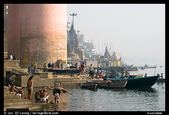 Ganges riverbank with men bathing. Varanasi, Uttar Pradesh, India (color)