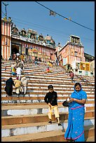 Woman and boy on temple steps, Kedar Ghat. Varanasi, Uttar Pradesh, India (color)