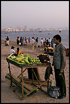 Food vendor on beach at dusk, Chowpatty Beach. Mumbai, Maharashtra, India (color)