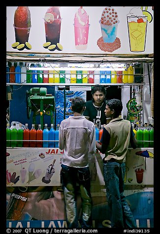 Stall with colorful drinks, Chowpatty Beach. Mumbai, Maharashtra, India (color)