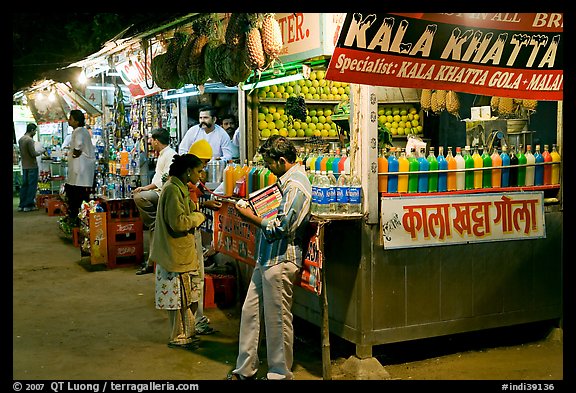 Drinks stall at night, Chowpatty Beach. Mumbai, Maharashtra, India (color)