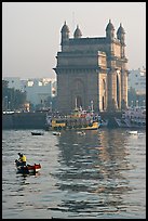 Small boat and Gateway of India, early morning. Mumbai, Maharashtra, India (color)