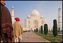 Men with turbans walking toward Taj Mahal, early morning. Agra, Uttar Pradesh, India (color)