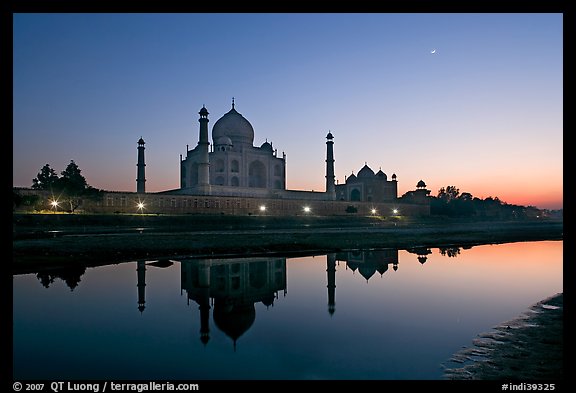 Taj Mahal complex reflected in Yamuna River at sunset. Agra, Uttar Pradesh, India