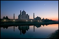 Taj Mahal complex reflected in Yamuna River at sunset. Agra, Uttar Pradesh, India