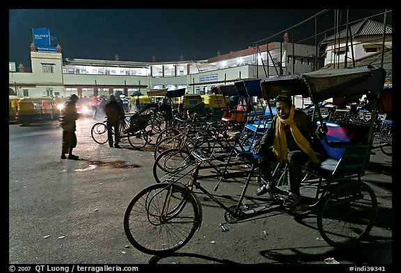 Cycle-rickshaws in front of train station. Agra, Uttar Pradesh, India (color)