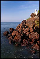 Boulders and christian statues overlooking ocean, Dona Paula. Goa, India (color)