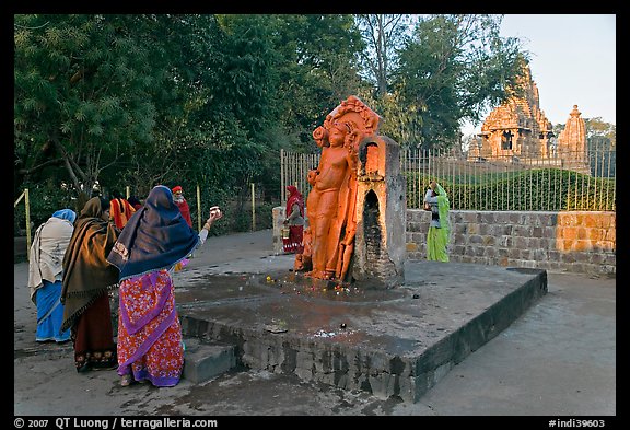 Women throwing water at  Shiva image. Khajuraho, Madhya Pradesh, India (color)