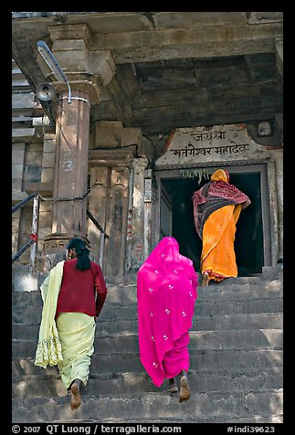 Women climbing up stairs on Matangesvara temple. Khajuraho, Madhya Pradesh, India (color)