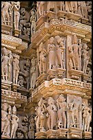 Sculptural details with apsaras, Kadariya-Mahadev temple. Khajuraho, Madhya Pradesh, India (color)