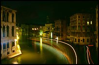 Light trails on the Grand Canal at night near the Rialto Bridge. Venice, Veneto, Italy (color)