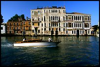 Water taxi passes in front of the Palazzo Dorio on the Grand Canal. Venice, Veneto, Italy