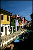 Canal lined with houses painted with bright colors, Burano. Venice, Veneto, Italy (color)